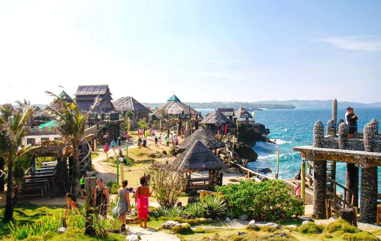Tourists strolling around Crystal Cove Island